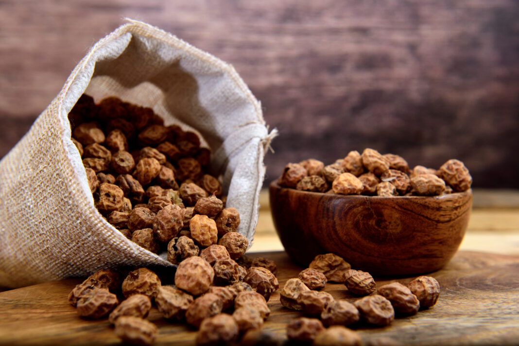 Organic Tiger nuts on a wooden table