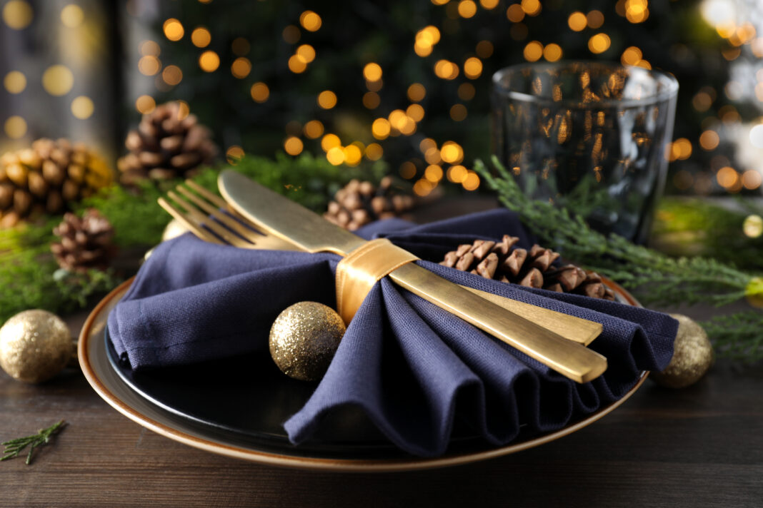 New Year table setting with bokeh on wooden table